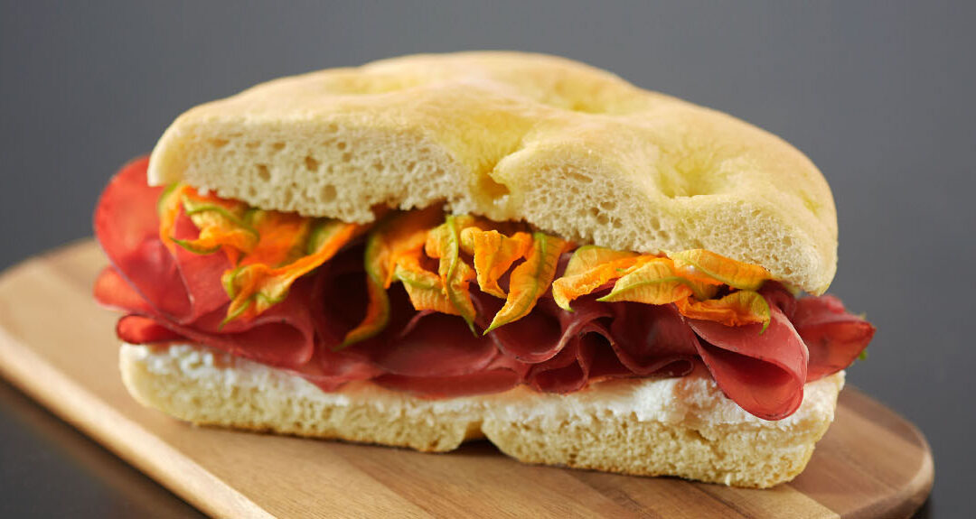 Focaccia with bresaola, zucchini flowers and goat cheese
