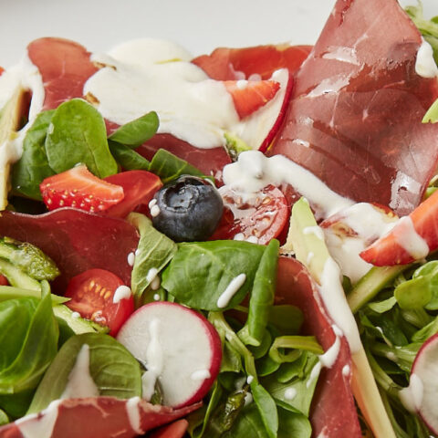 Bresaola with fruit and vegetable salad