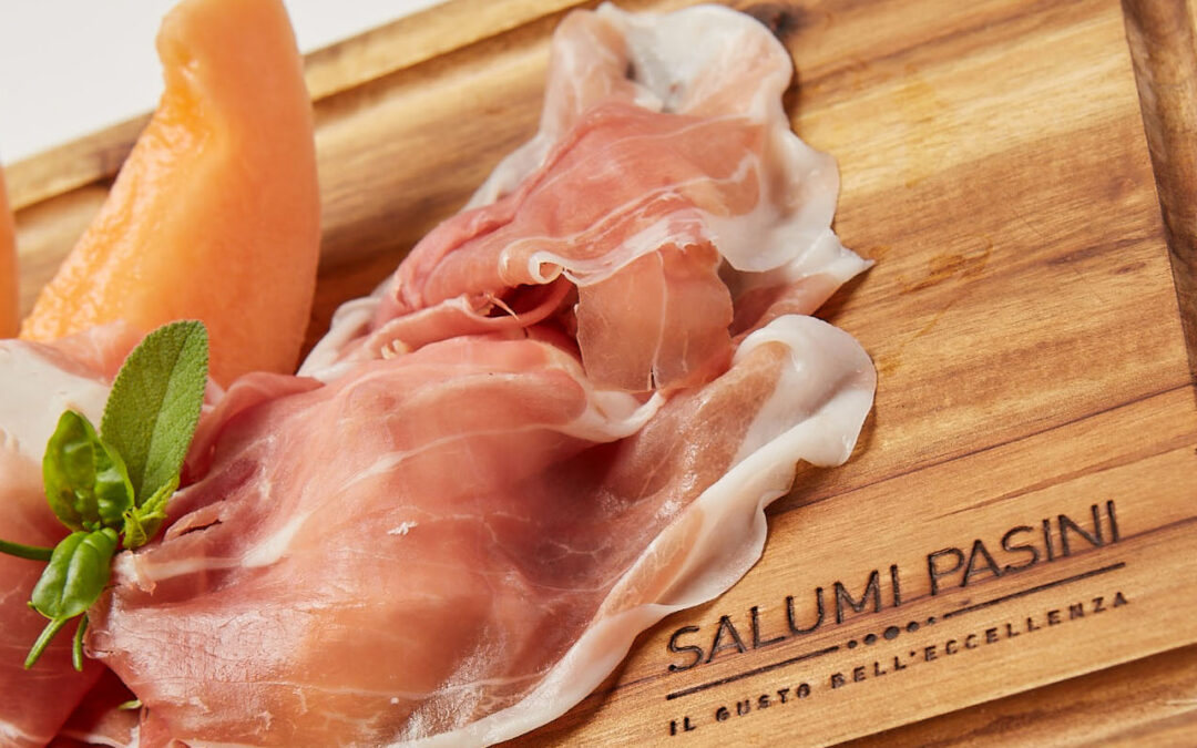 Ham and melon on a cutting board