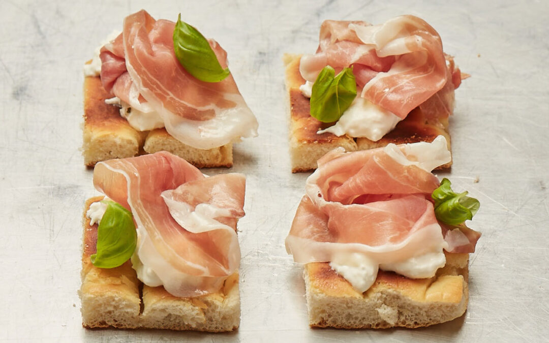 Focaccia with ham, burrata and basil